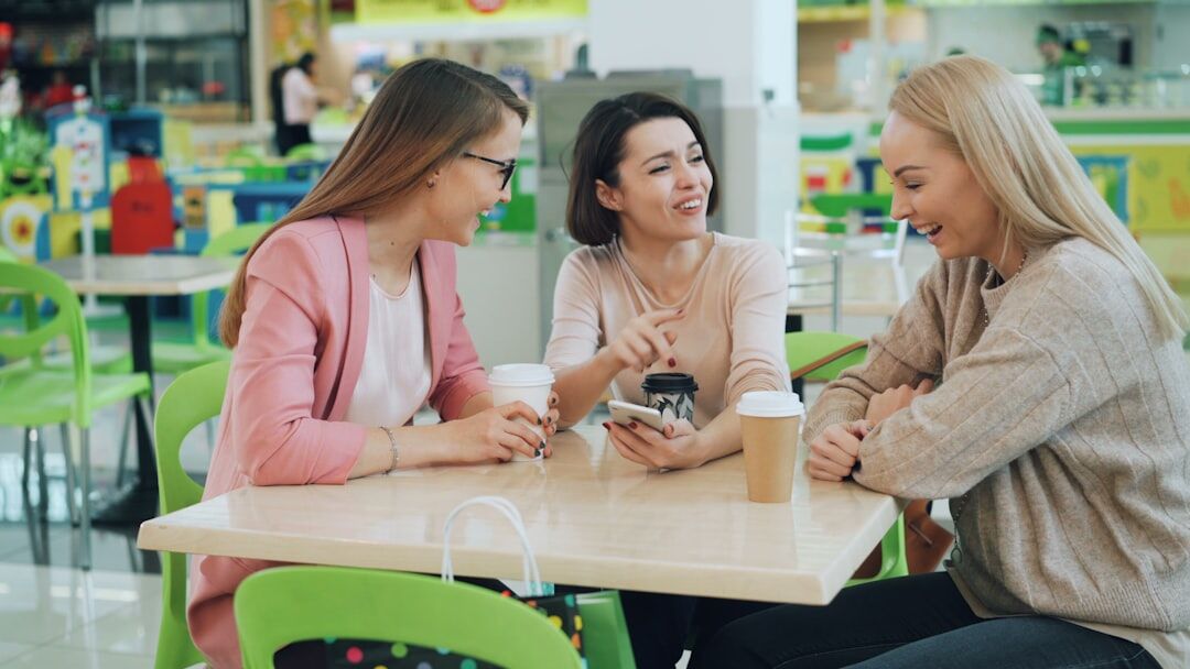 friends having deep conversation in cafe