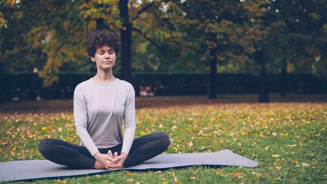 person meditating outdoors